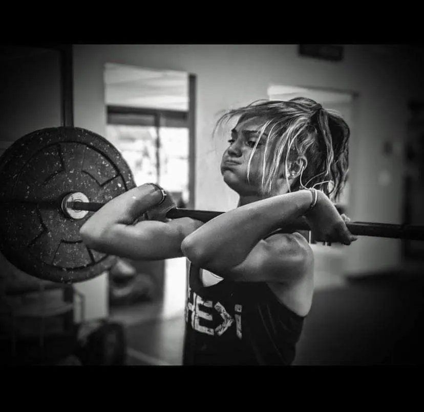 Junior athlete in the front rack mid-effort