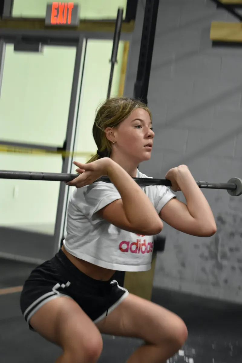 Athlete coming up out of a front squat