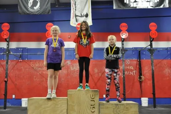 Youngest division athletes on the podium with medals
