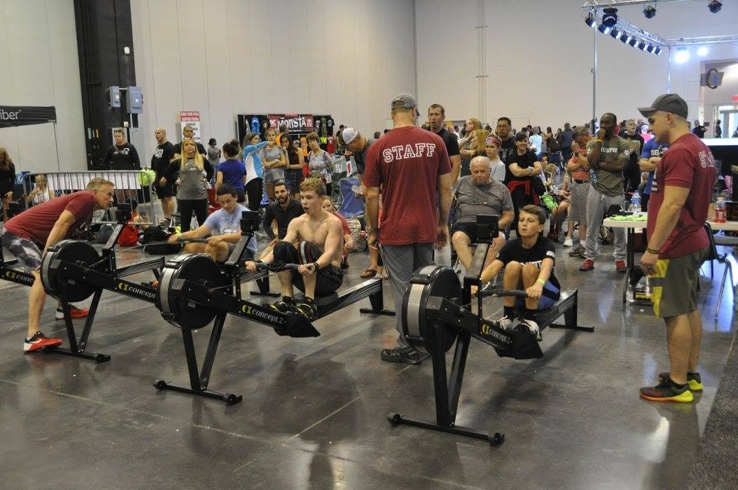 Junior athletes on the rowers at a Garage Games competition