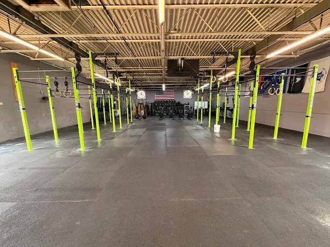 The new green Rogue competition rig installed across the full floor at CrossFit Gallant